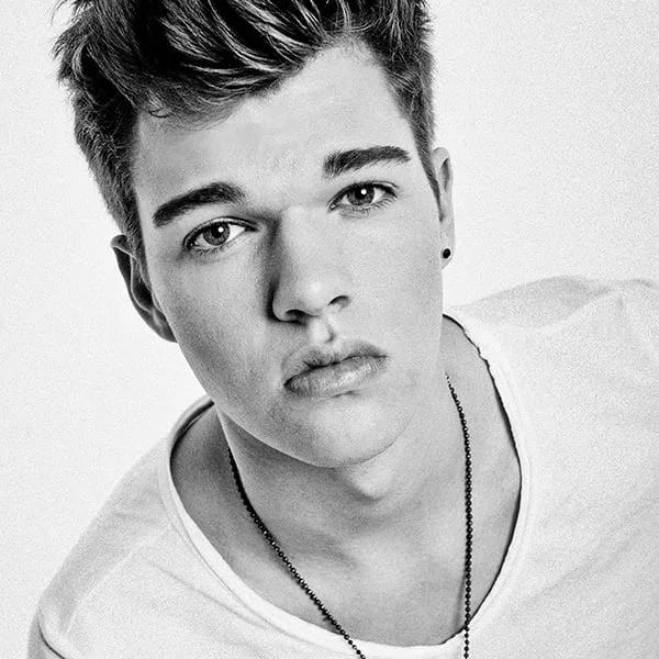 promotional portrait in black and white of young male singer by portrait photographer in Glasgow, Scotland