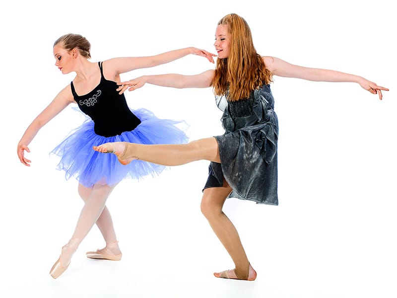 a ballet and a contemporary dance student in pose at dance school photoshoot