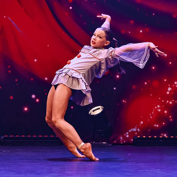 girl dancer in piero costume competes in dance competiton