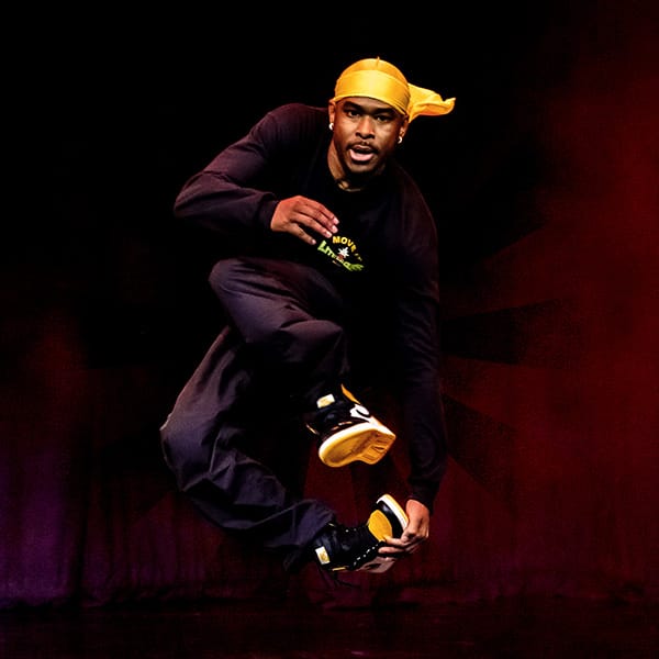 male hip hop dancer with yellow bandana dance show photography