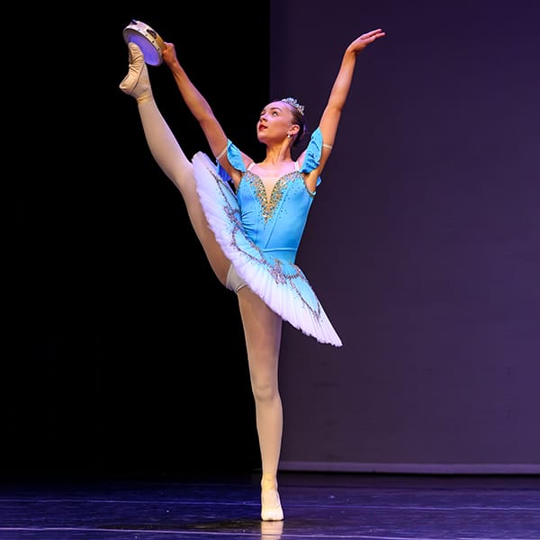 young solo dancer high kicks in dance competition