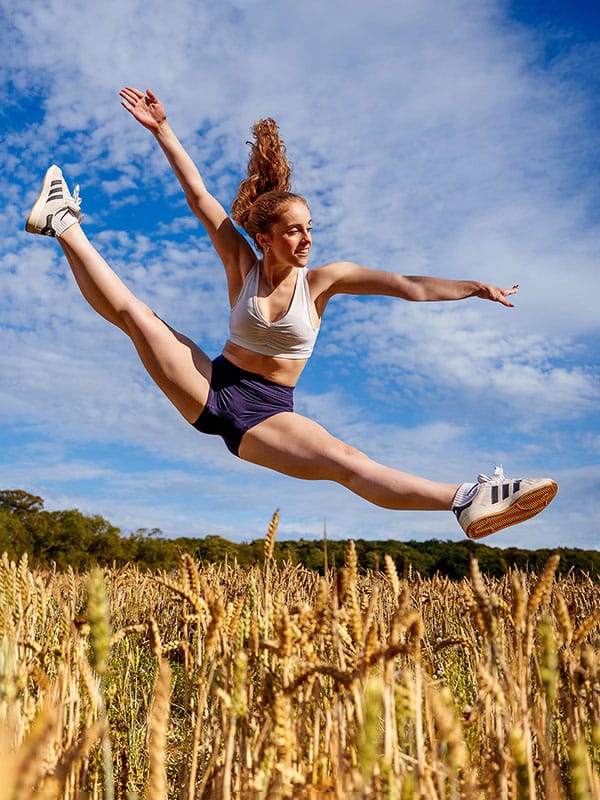 Dancer_leaps_above_wheat